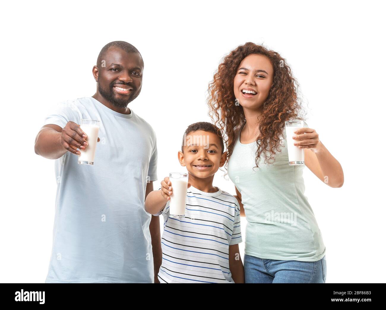 African American Family With Milk On White Background Stock Photo Alamy