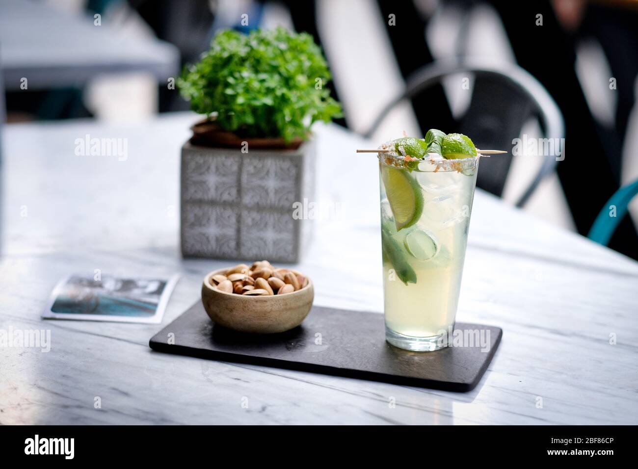 Refreshed Mojito cocktail with Cookie on the marble table. Summer exotic colorful cocktail Stock Photo