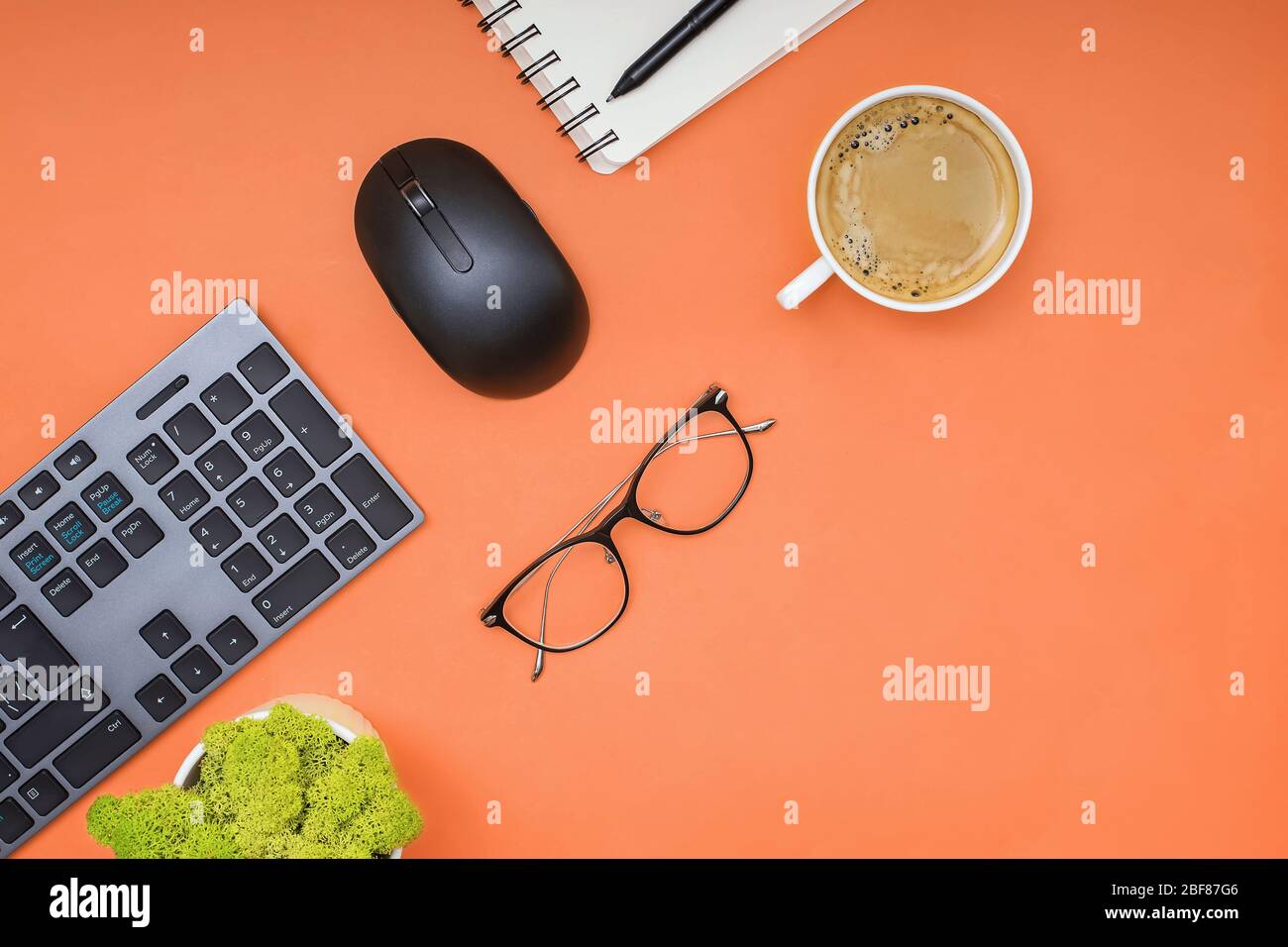 Keyboard, computer mouse and cofffe on yellow background Stock Photo