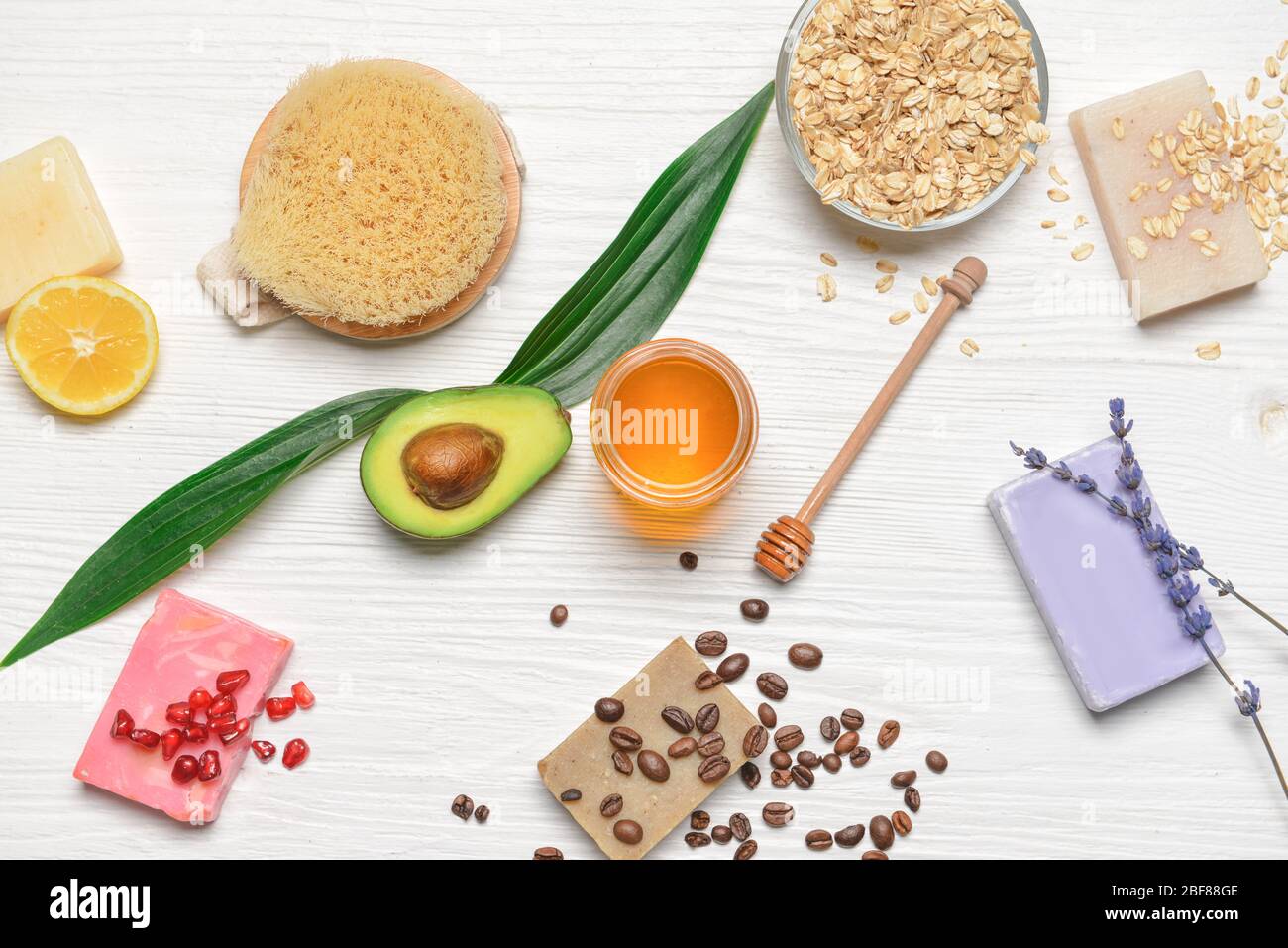 Spa items and honey on white wooden background Stock Photo