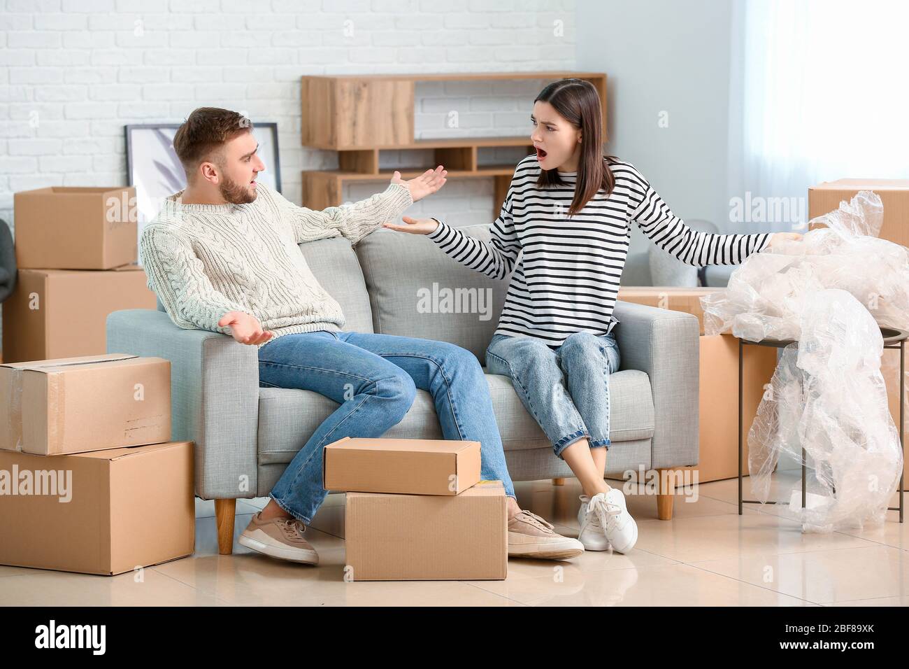 Young couple in their new flat on moving day Stock Photo - Alamy