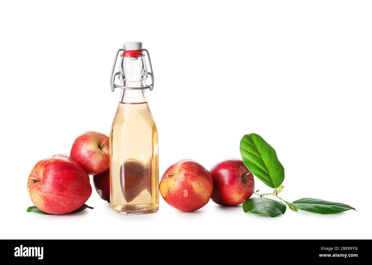 Bottle of apple cider vinegar on white background Stock Photo - Alamy