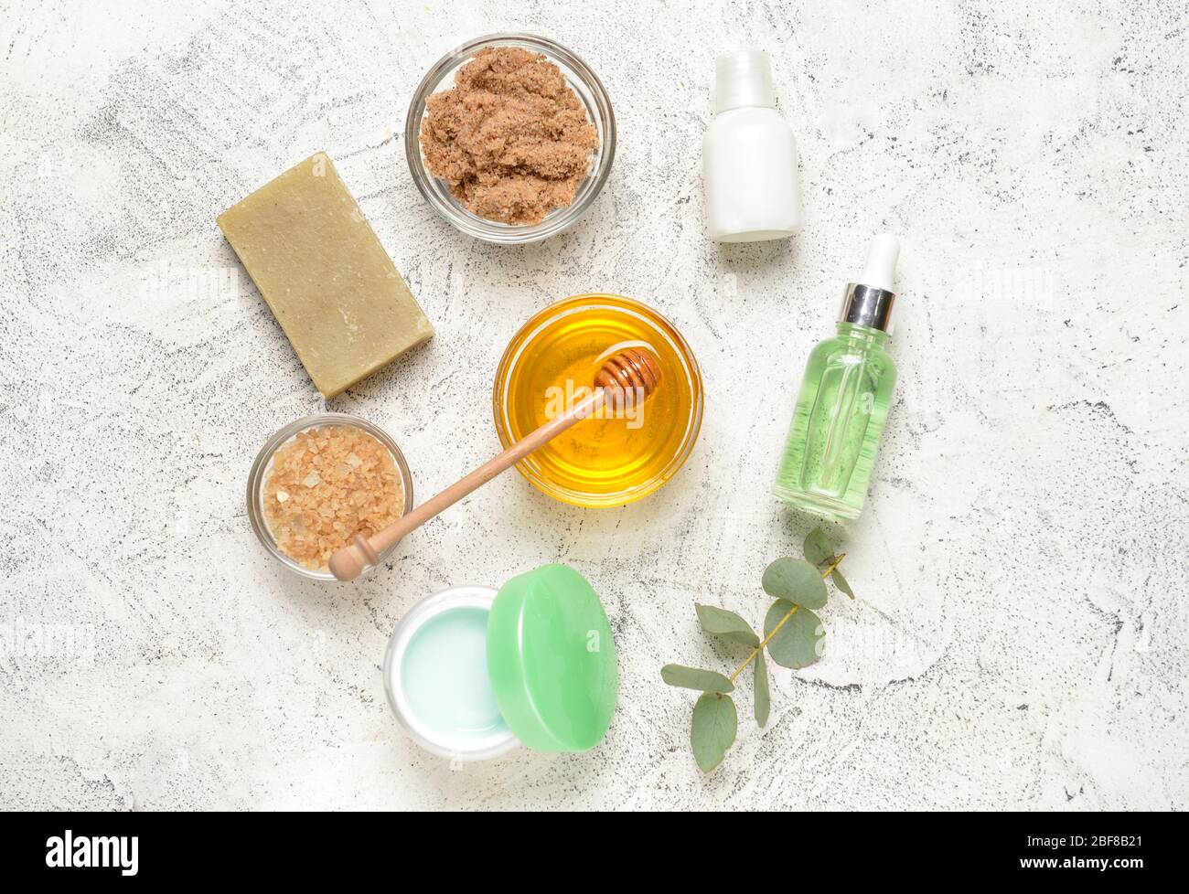 Composition with spa items and honey on light background Stock Photo