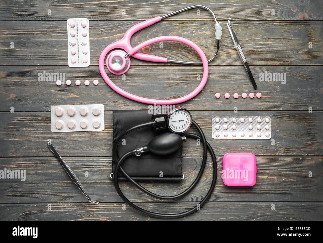 First aid kit on wooden background Stock Photo