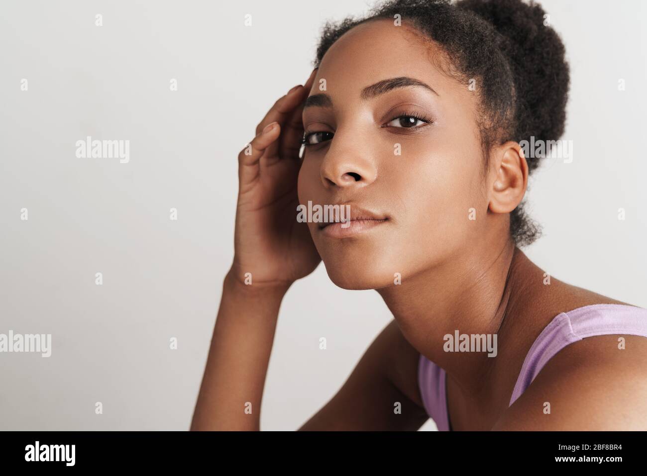 Portrait closeup of african american confident woman looking at camera ...