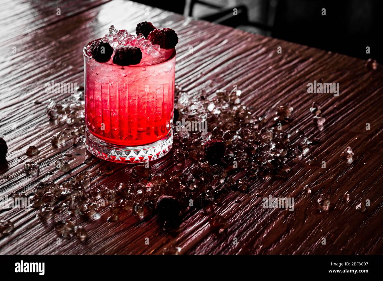 Red and Pink Fresh Colorful Exotic Alcoholic Cocktail with Blackberry on the Wooden Table. Red and Pink Mojito Stock Photo