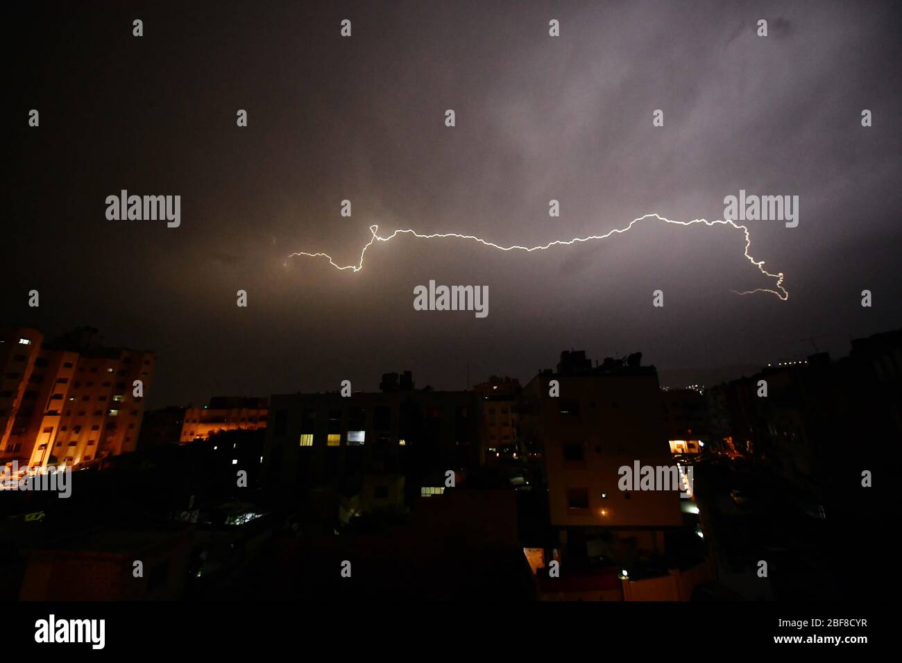 (200417) -- DAMASCUS, April 17, 2020 (Xinhua) -- A thunderstorm is seen in Damascus, capital of Syria, April 16, 2020. (Photo by Ammar Safarjalani/Xinhua) Stock Photo
