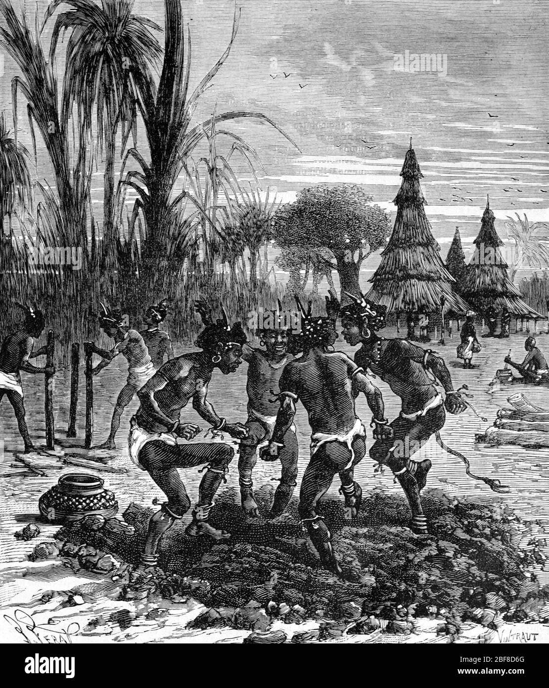 African Villagers Pounding Mud for Adobe Architecture & Traditional Tall Conical Grass & Mud Huts by Native or Tribal Africans in Tanzania Africa. Vintage or Old Illustration or Engraving 1889 Stock Photo