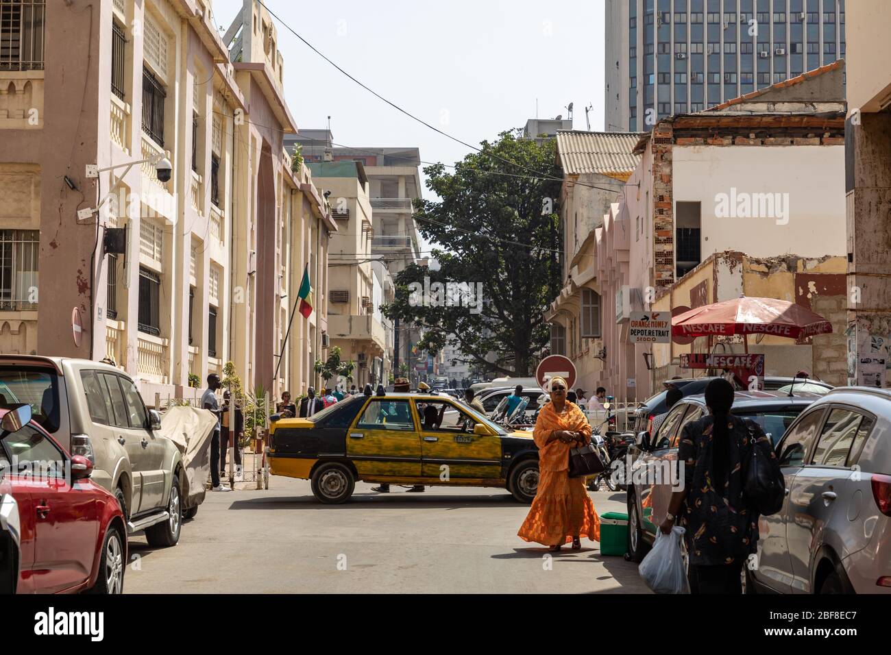 DAKAR, SENEGAL - NOVEMBER 11, 2019: People working and traffic at Senegal capital Dakar, West Africa. Stock Photo