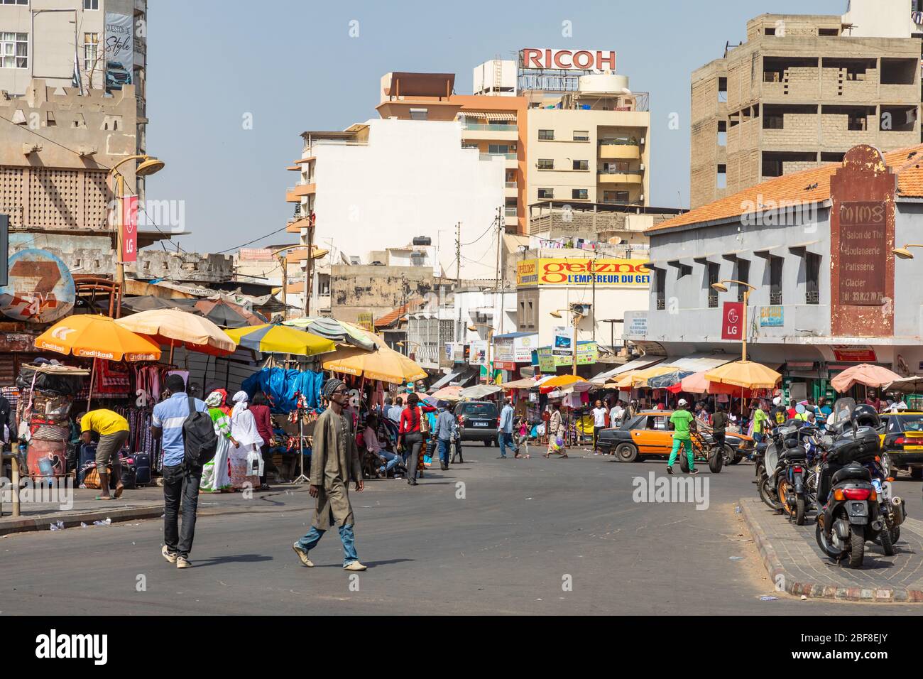 DAKAR, SENEGAL - NOVEMBER 11, 2019: People working and traffic at Senegal capital Dakar, West Africa. Stock Photo