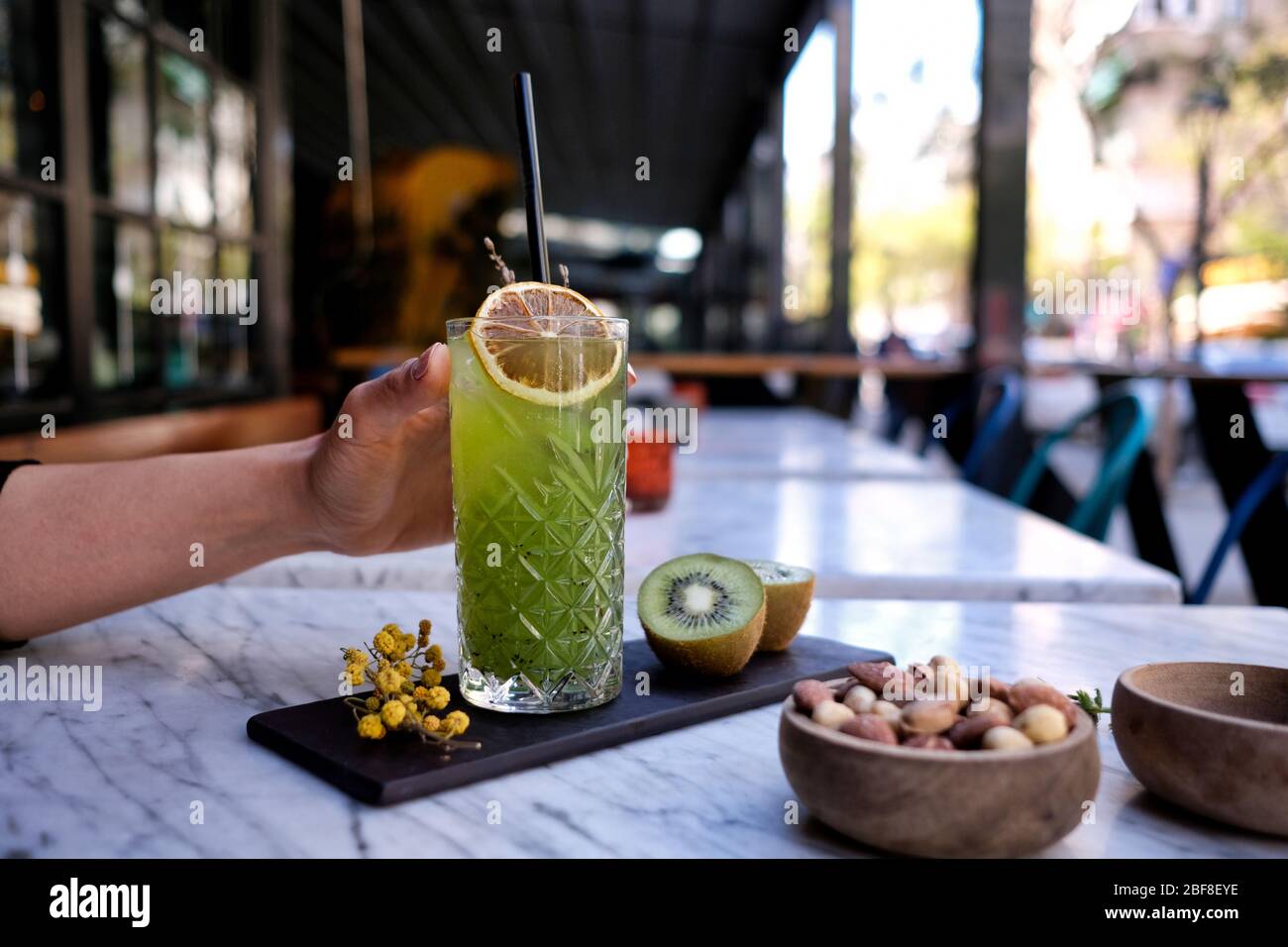 Refreshed Mojito cocktail with Cookie on the marble table. Summer exotic colorful cocktail Stock Photo