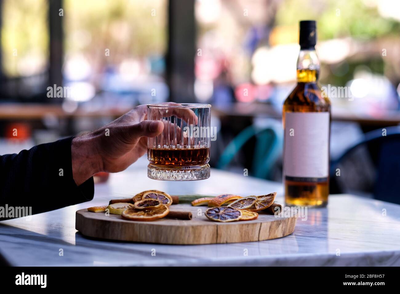 A bottle of whiskey. Drink a glass of whiskey alcohol on the presentation board Stock Photo