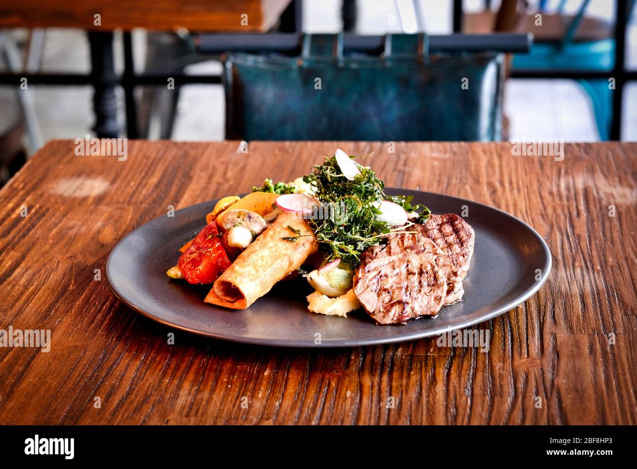 Specially crafted beef steak accompanied by red wine Stock Photo