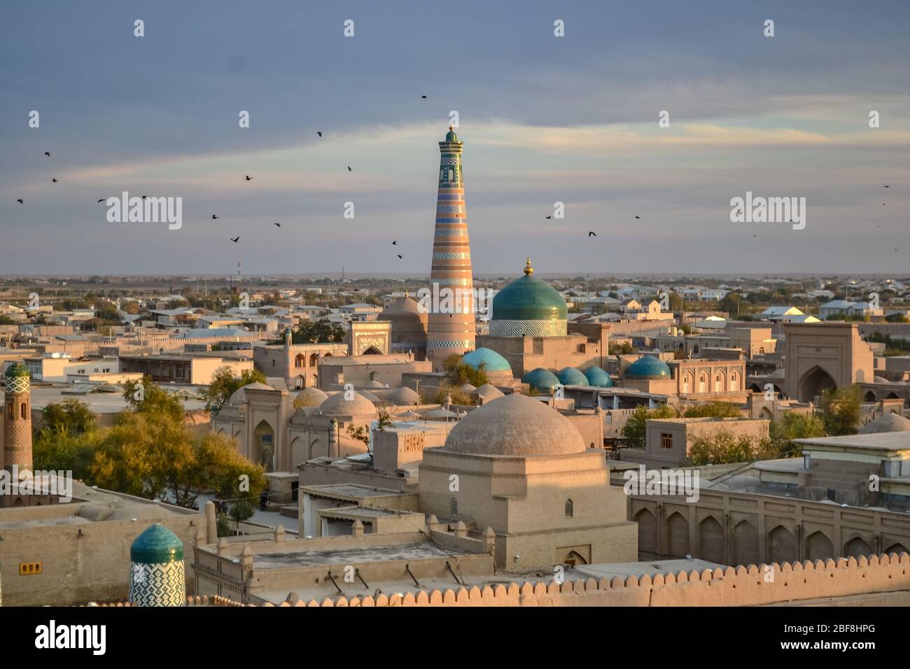 Beautiful Cityscape With Large Islamic Minaret Over Khiva Uzbekistan beautiful-cityscape-with-large-islamic-minaret-over-khiva-uzbekistan
