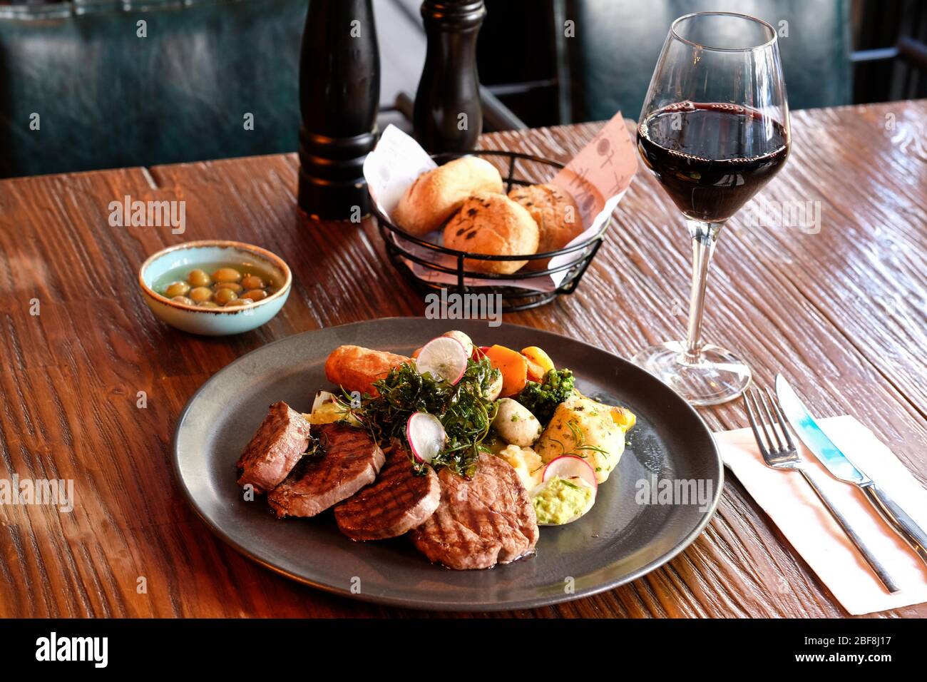 Specially crafted beef steak accompanied by red wine Stock Photo