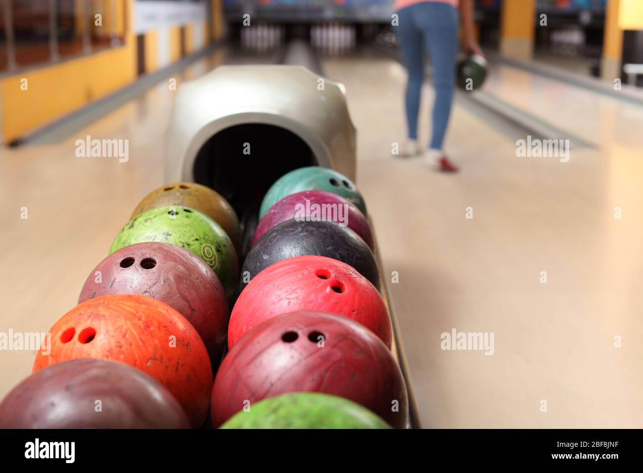 Stand with balls in bowling club Stock Photo Alamy