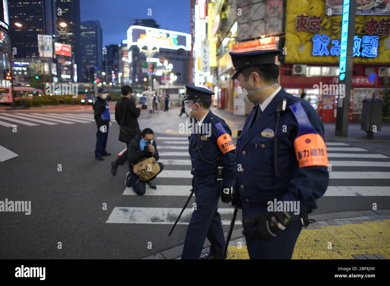 TOKYO, JAPAN - APRIL 17: Police officers watch around the Kabukicho entertainment district amid the coronavirus pandemic on April 17, 2020 in Tokyo. The government of Japan has requested that businesses including schools, athletic facilities, bars and restaurants to temporarily close or operate under reduced hours during Nationwide State of Emergency. The Japanese government decided to expand the current areas under a state of emergency to nationwide, as the Covid-19 coronavirus outbreak continues to spread throughout the country. Credit: Aflo Co. Ltd./Alamy Live News Stock Photo