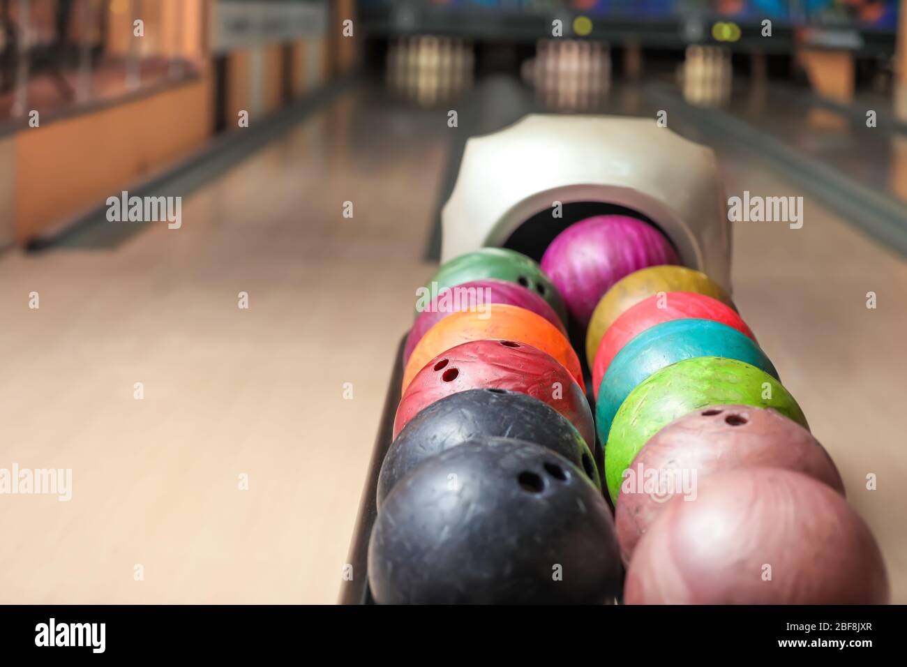 Stand with balls in bowling club Stock Photo Alamy