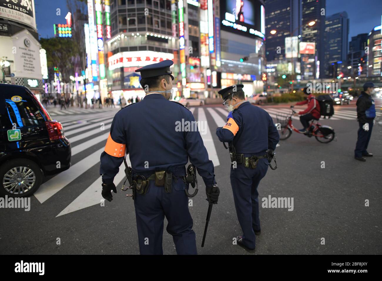 TOKYO, JAPAN - APRIL 17: Police officers watch around the Kabukicho entertainment district amid the coronavirus pandemic on April 17, 2020 in Tokyo. The government of Japan has requested that businesses including schools, athletic facilities, bars and restaurants to temporarily close or operate under reduced hours during Nationwide State of Emergency. The Japanese government decided to expand the current areas under a state of emergency to nationwide, as the Covid-19 coronavirus outbreak continues to spread throughout the country. Credit: Aflo Co. Ltd./Alamy Live News Stock Photo