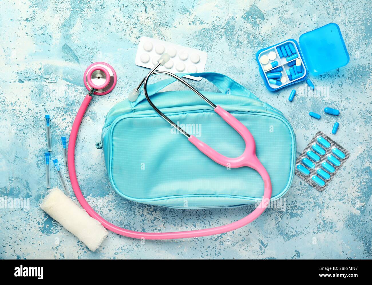 First aid kit on color background Stock Photo