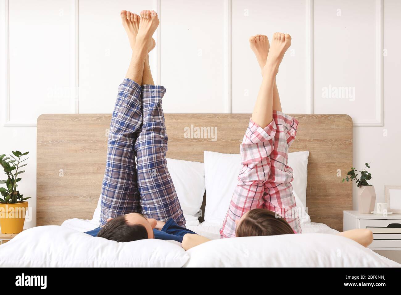 https://c8.alamy.com/comp/2BF8NNJ/young-couple-lying-in-bed-at-home-2BF8NNJ.jpg