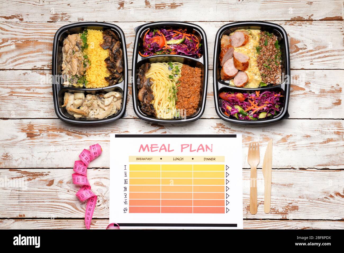 Food Container Plan Containers with healthy food, measuring tape and meal plan on wooden ...