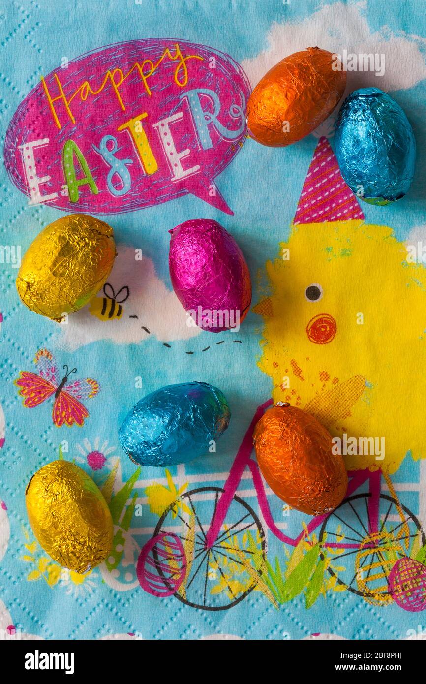 M&S choccy eggs, solid milk chocolate eggs on Happy Easter napkin