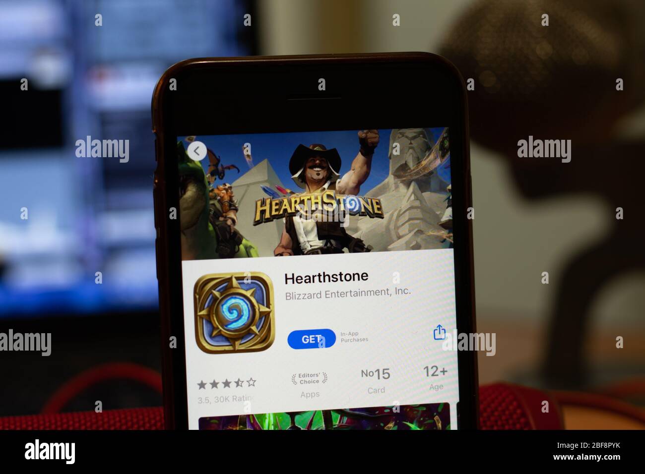 Los Angeles, California, USA - 16 April 2020: Hearthstone logo on screen close up. App store icon visible on phone display, Illustrative Editorial Stock Photo