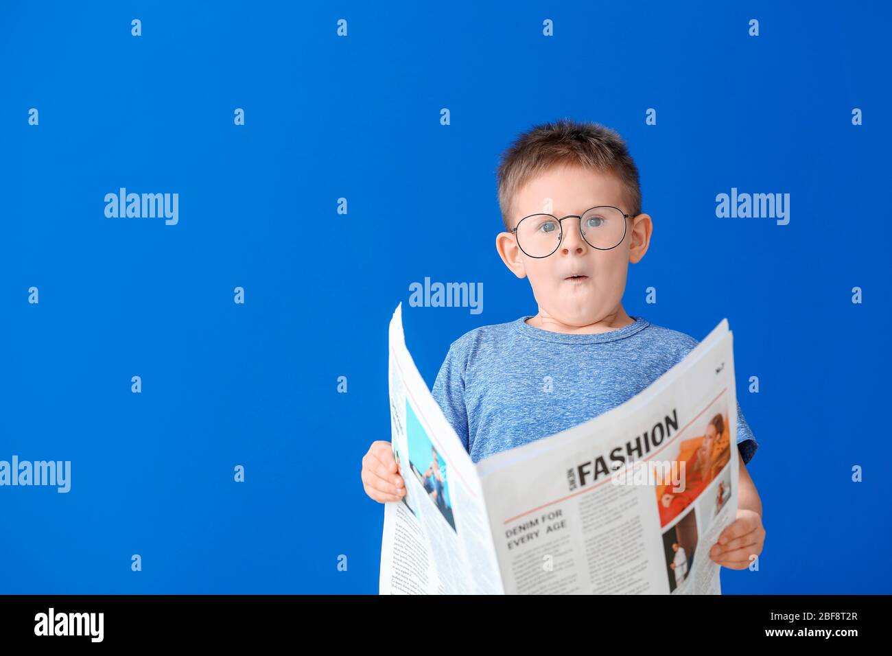Shocked Little Boy Reading Newspaper On Color Background Stock Photo Alamy Shocked Little Boy Reading Newspaper On Color Background Stock Photo Alamy