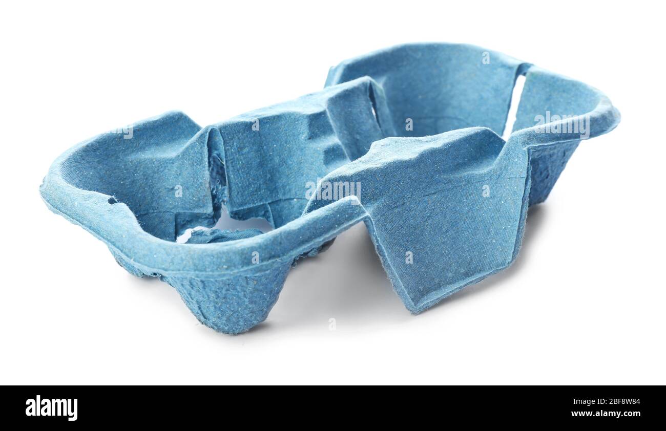 Cardboard eggs holder on white background. Recycling concept Stock