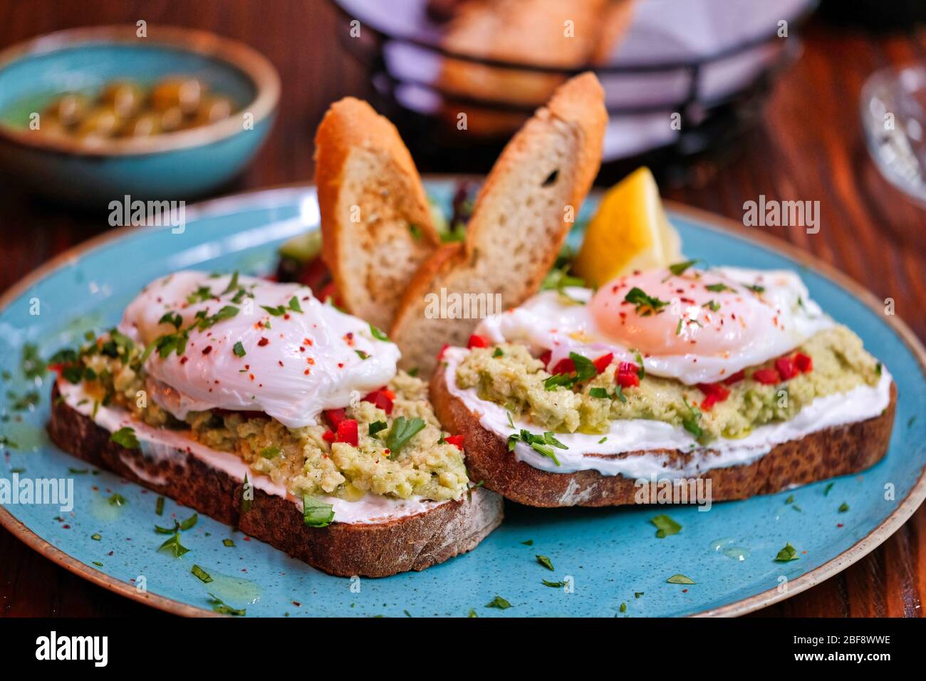 Traditional Turkish tea on bread for breakfast in the morning and Pois egg over avocado. Traditional Turkish tea and breakfast. Stock Photo