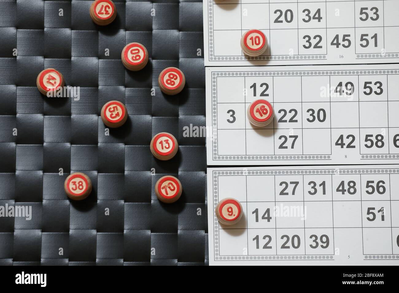 Casino bingo playing cards, game dice and numbers on a black and white