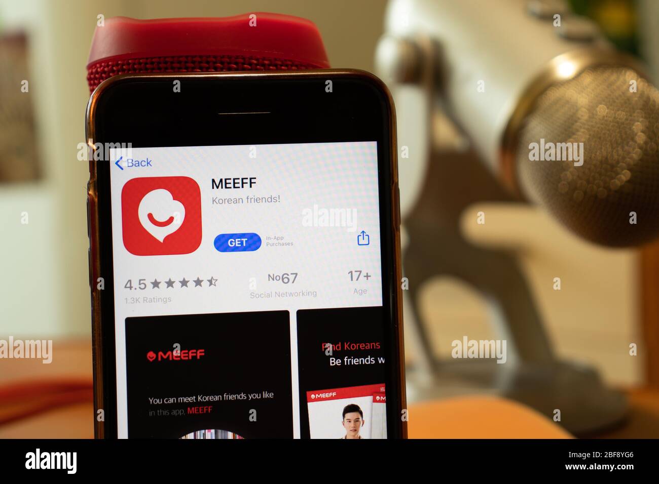 Los Angeles, California, USA - 16 April 2020: MEEFF logo on screen close up. App store icon visible on phone display, Illustrative Editorial Stock Photo