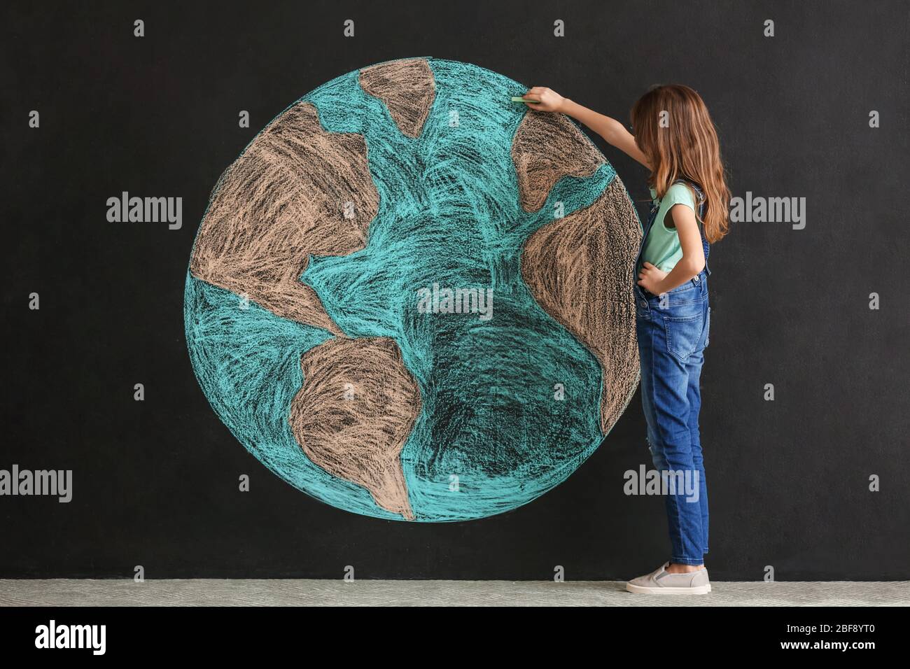 Little Girl Drawing Planet On Dark Background Earth Day Celebration Stock Photo Alamy