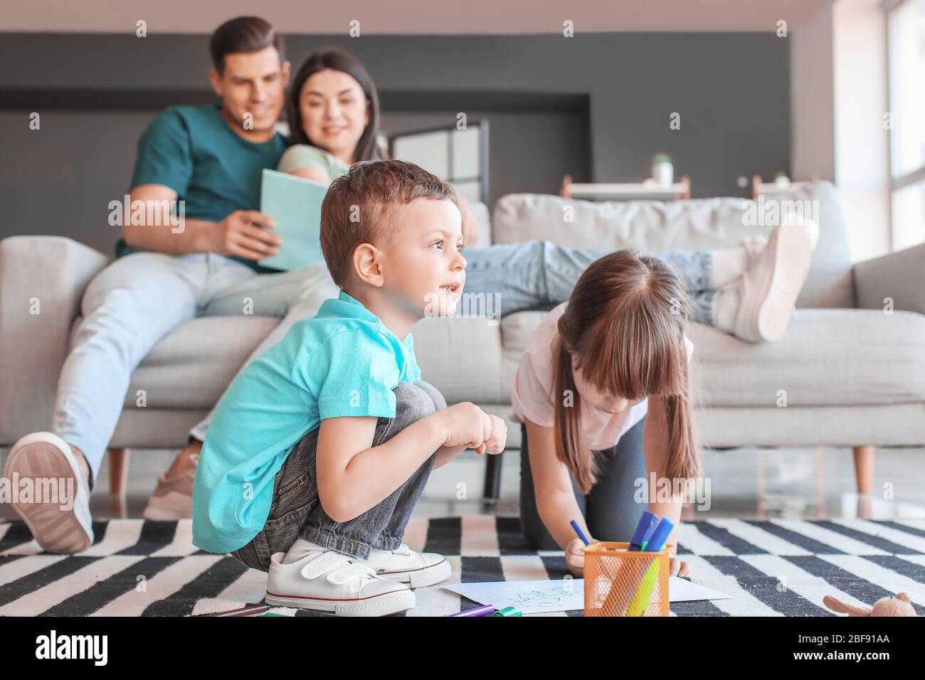 Happy family spending time together at home Stock Photo