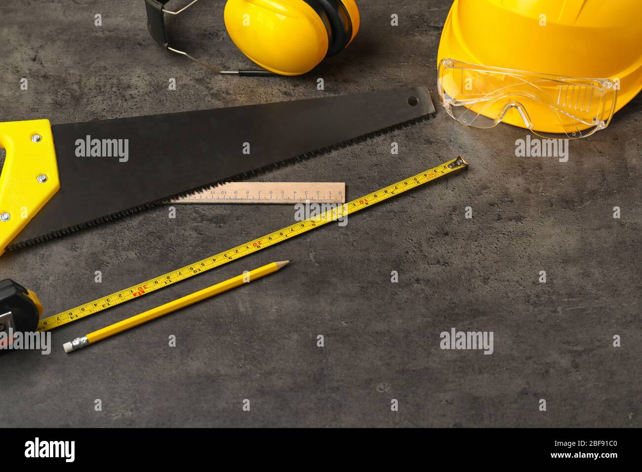 Builder's supplies on dark background Stock Photo
