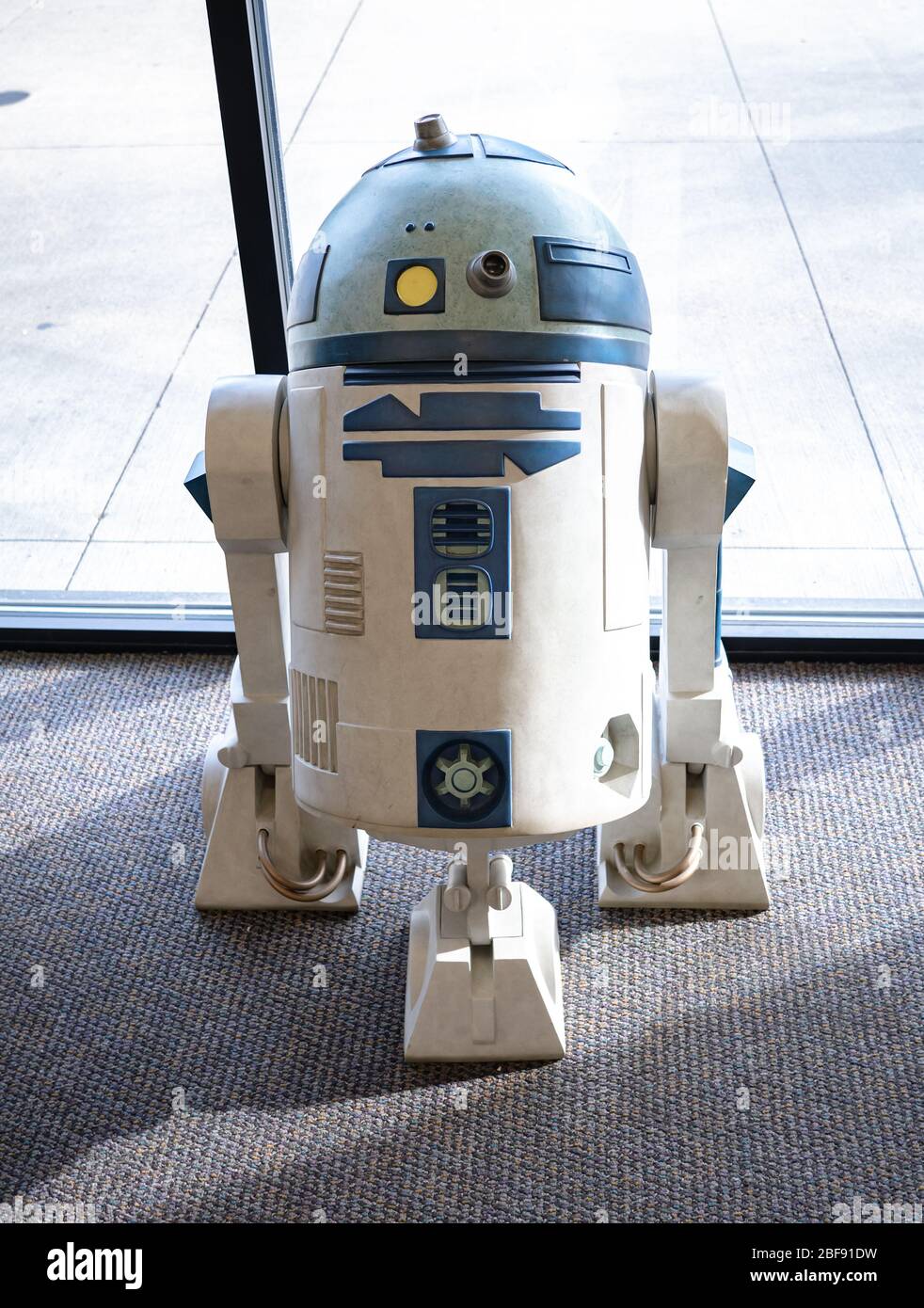 A life-size action figure of R2-D2 kept on display at a local comic book store. Stock Photo