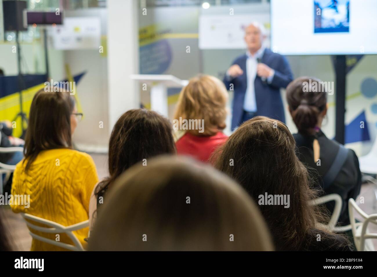 Business Forum Visitors Register At The Front Desk Stock Photo Alamy