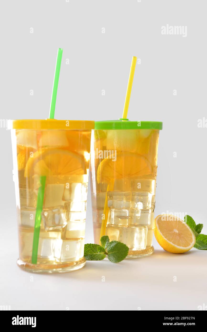 Glasses of tasty cold ice tea on grey background Stock Photo - Alamy