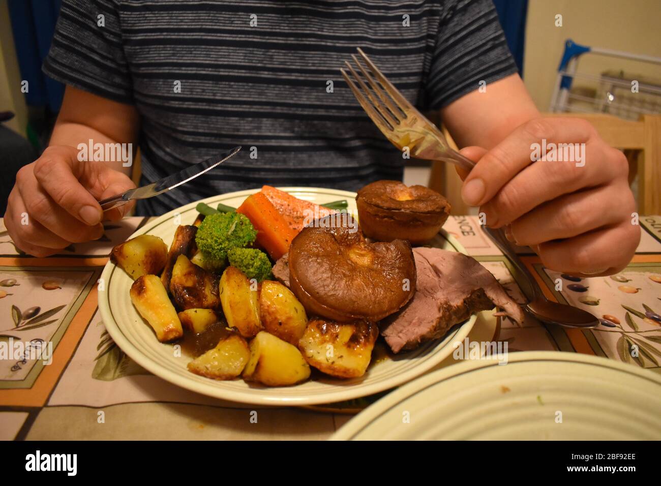 Traditional British food Homemade Sunday lamb roast dinner with gravy