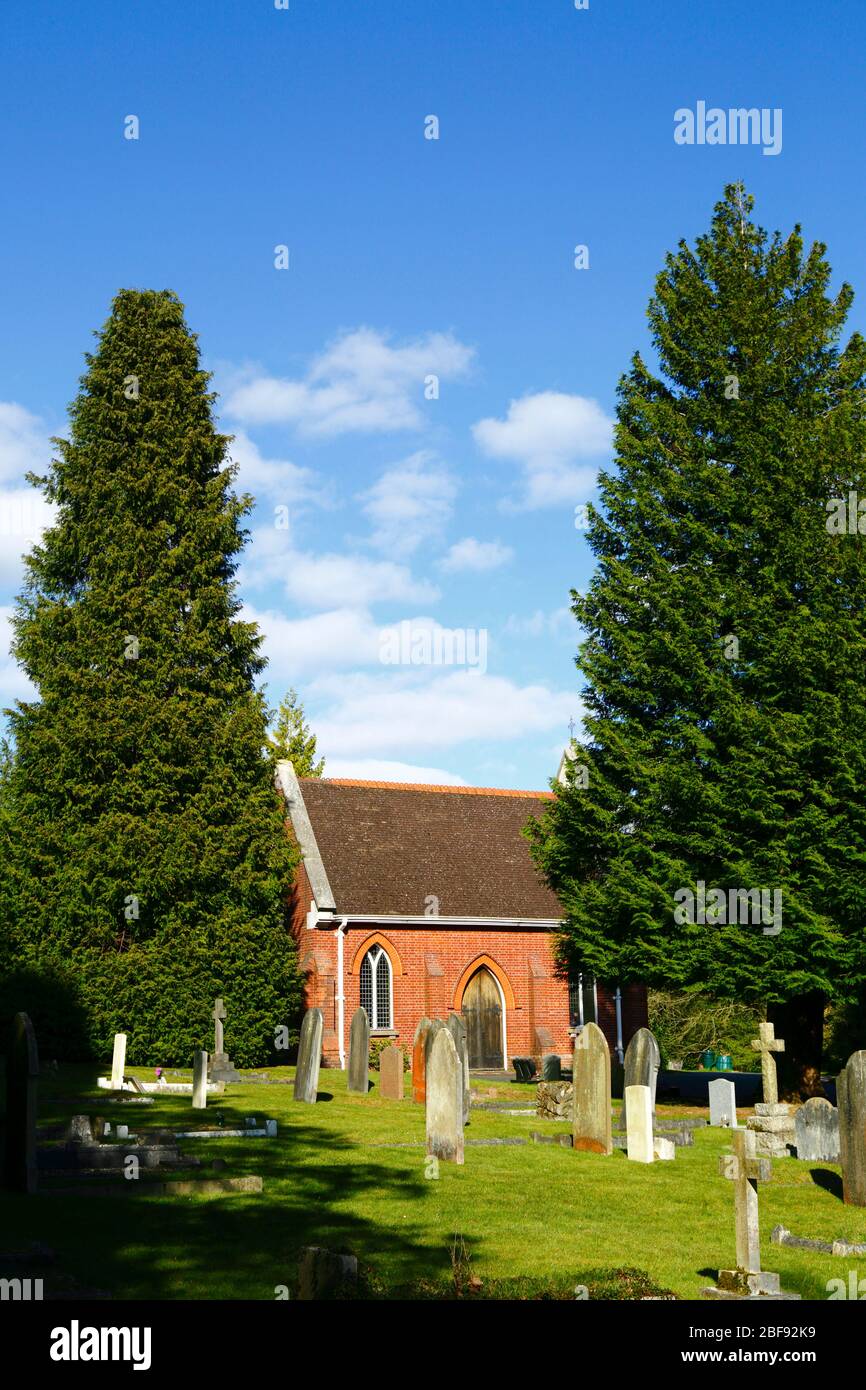 Chapel and cupressus trees in town council run cemetery near Modest Corner, Southborough Common, near Tunbridge Wells, Kent, England Stock Photo