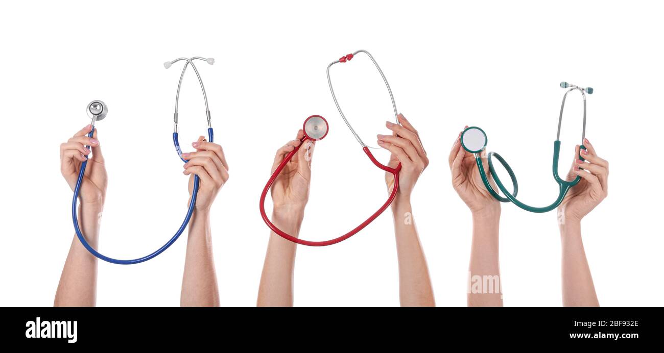Many hands with stethoscopes on white background Stock Photo - Alamy