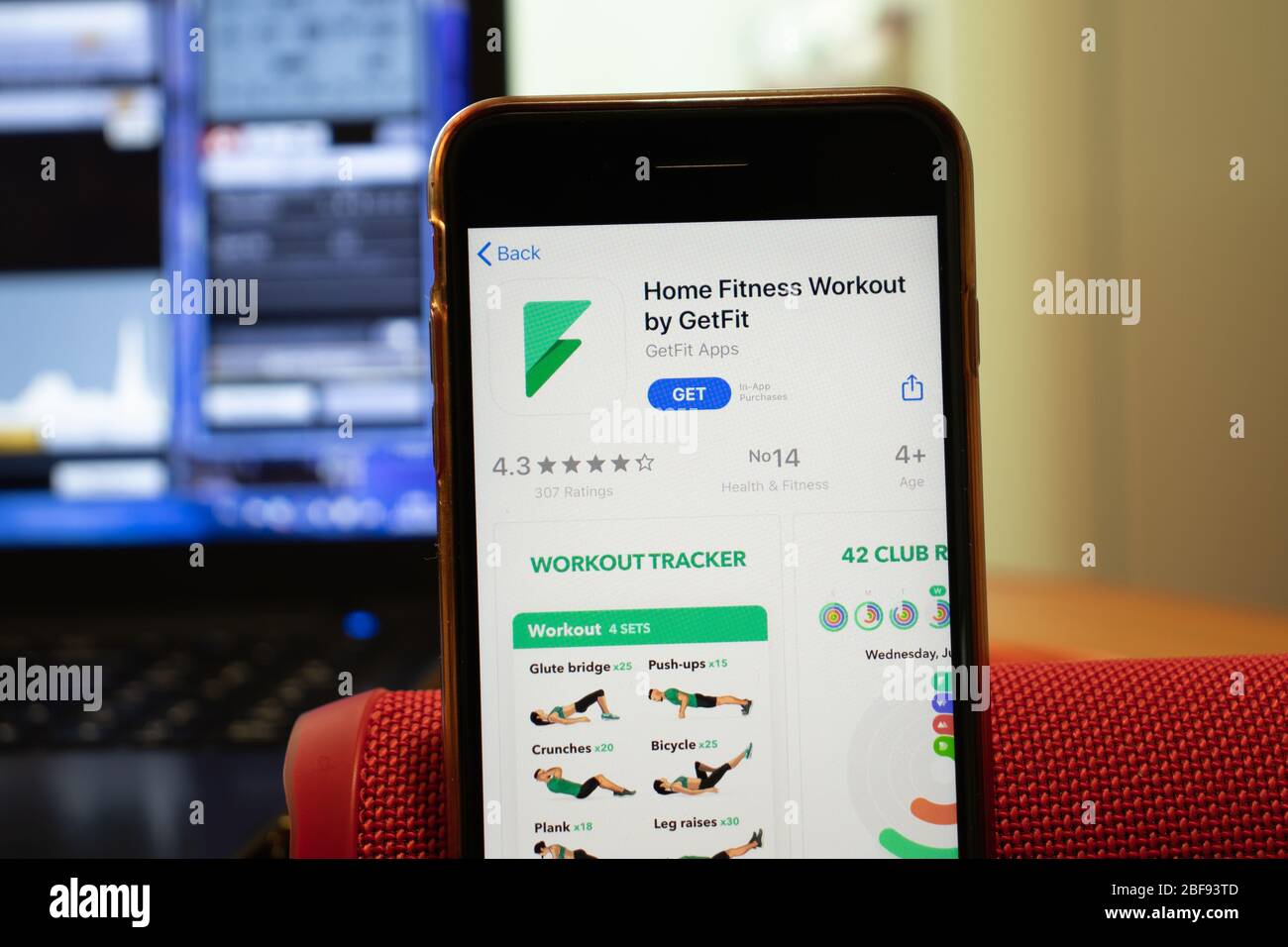 Los Angeles, California, USA - 16 April 2020: Home Fitness Workout by GetFit logo on screen close up. App store icon visible on phone display Stock Photo