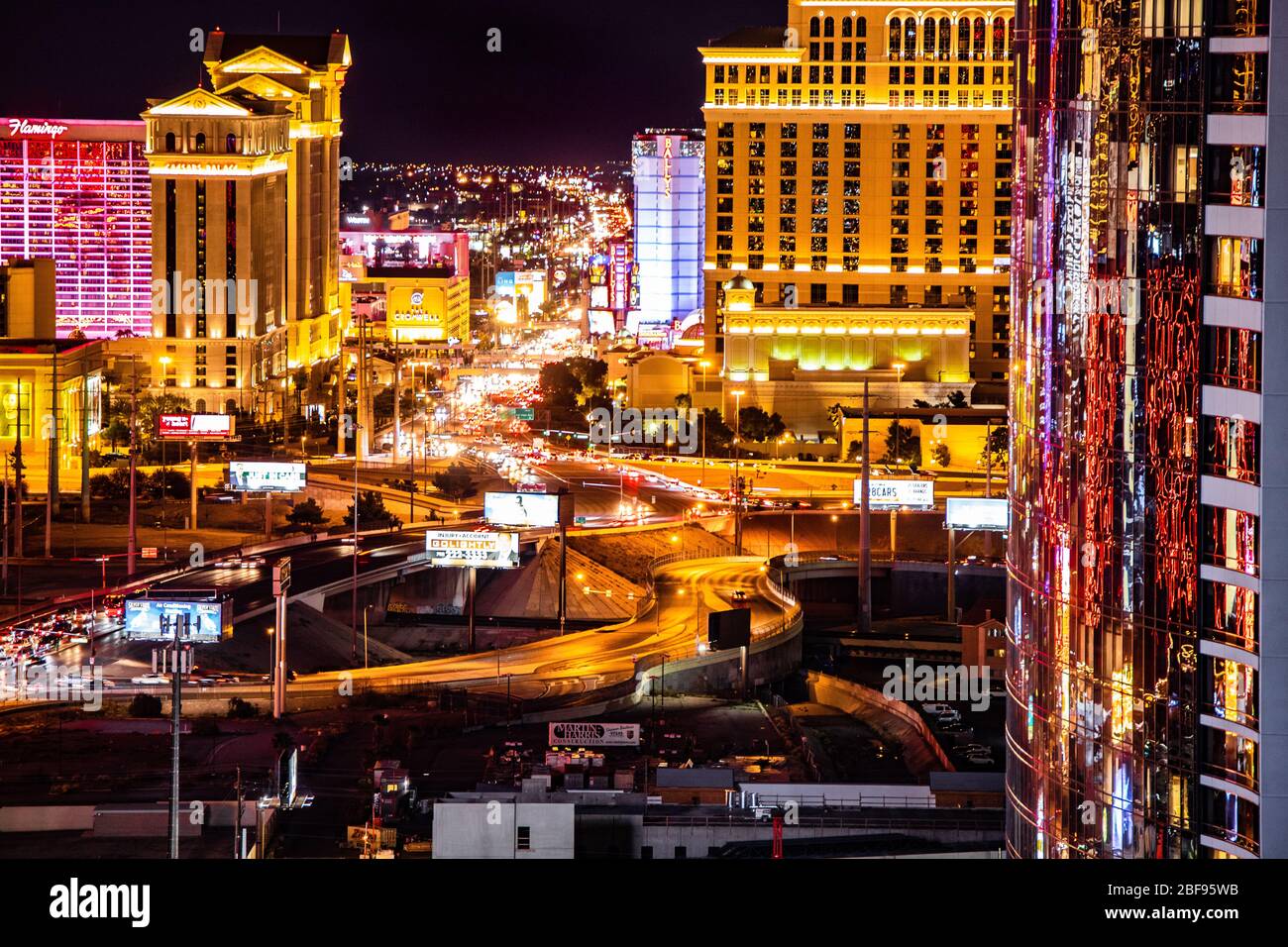 LAS VEGAS, NEVADA - FEBRUARY 23, 2020: Evening view across Las Vegas from above with lights and  resort casino hotels in view. Stock Photo