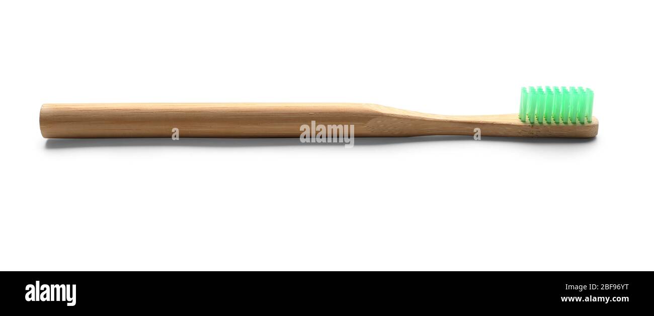 Wooden tooth brush on white background Stock Photo - Alamy