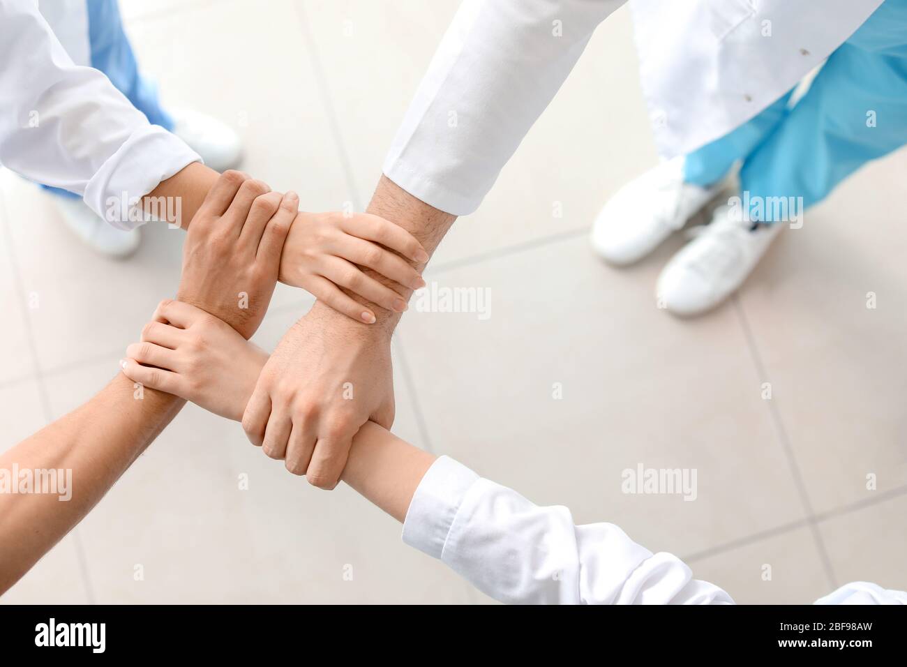 Doctors Unity Hand Doctors holding hands hi-res stock photography and images - Alamy