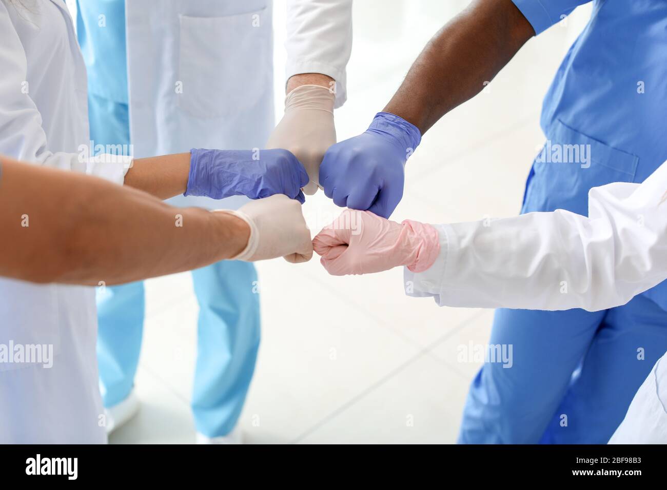 Doctors Unity Hand Group of doctors putting hands together in clinic. Unity concept Stock ...