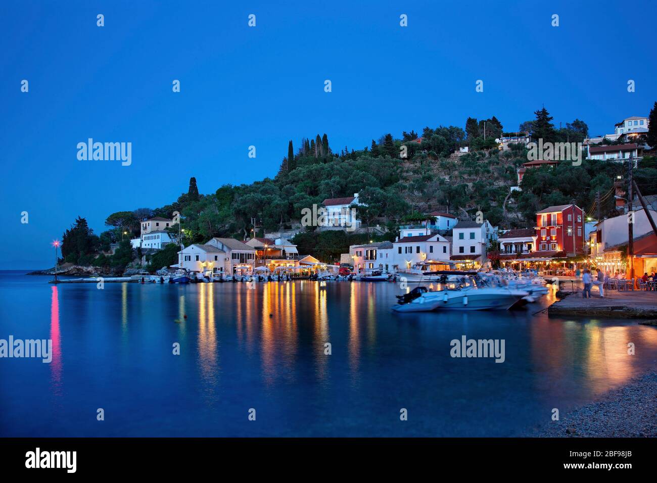 Night view of  Loggos (or 'Longos') village, Paxos island, Kerkyra (Corfu) prefecture, Ionian Sea, Eptanisa. Stock Photo