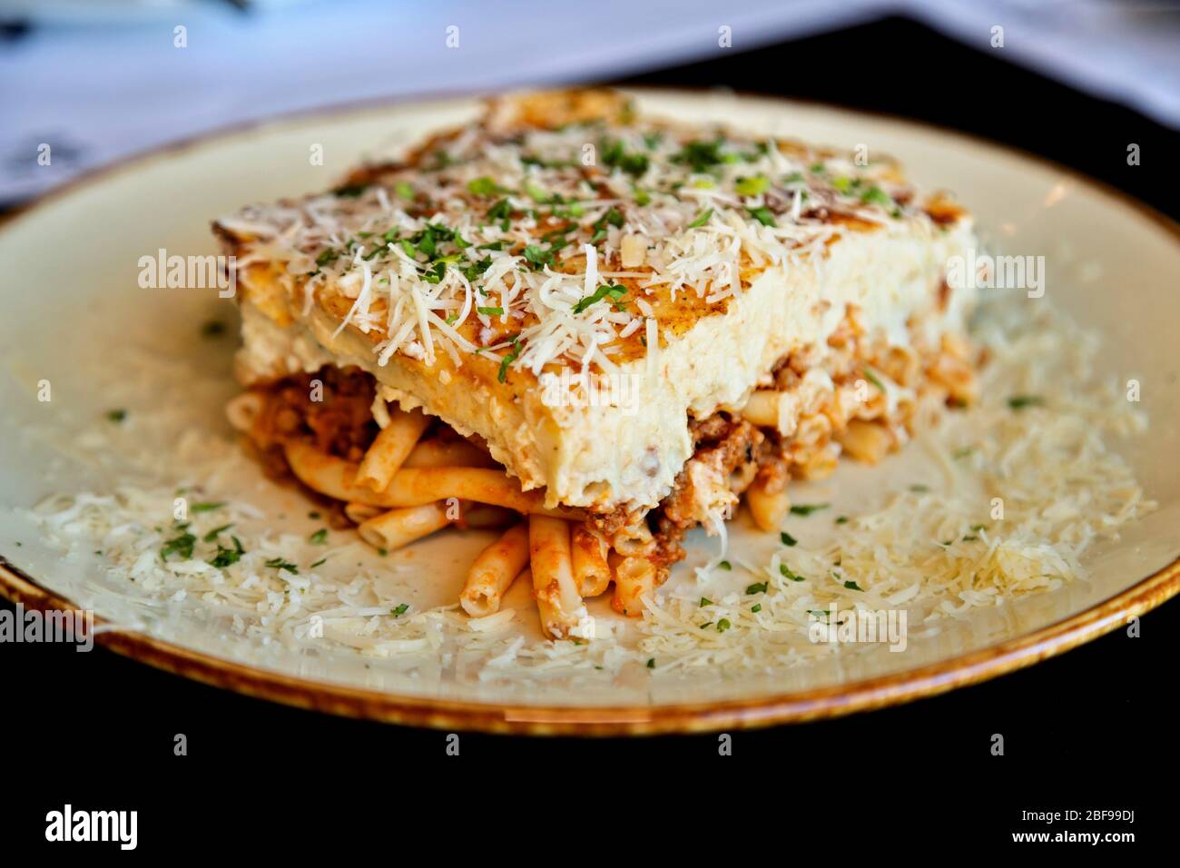 Pastitsio (or Pastichio, is a Greek baked pasta dish with ground meat and béchamel sauce. Stock Photo
