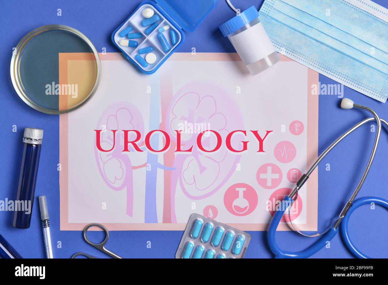 Paper sheet with text UROLOGY, stethoscope, urine sample and medicines